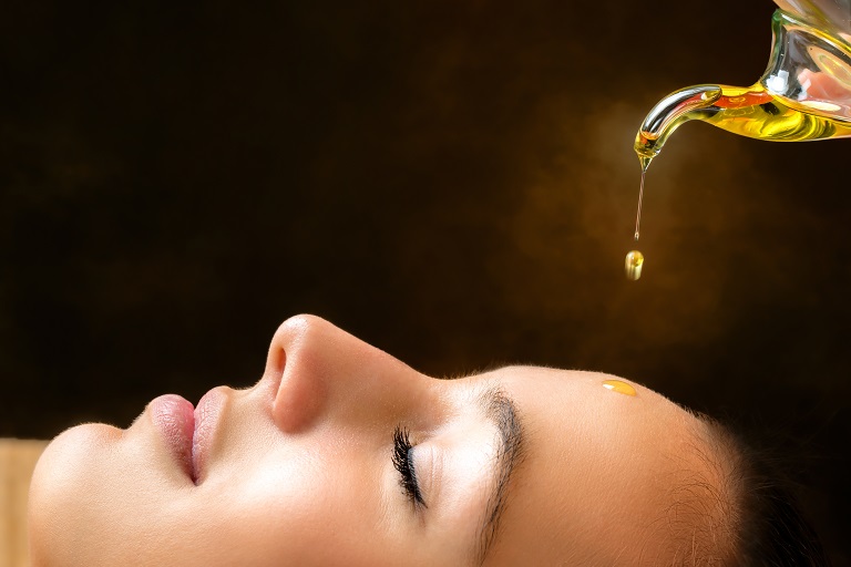 head massage with warm oil